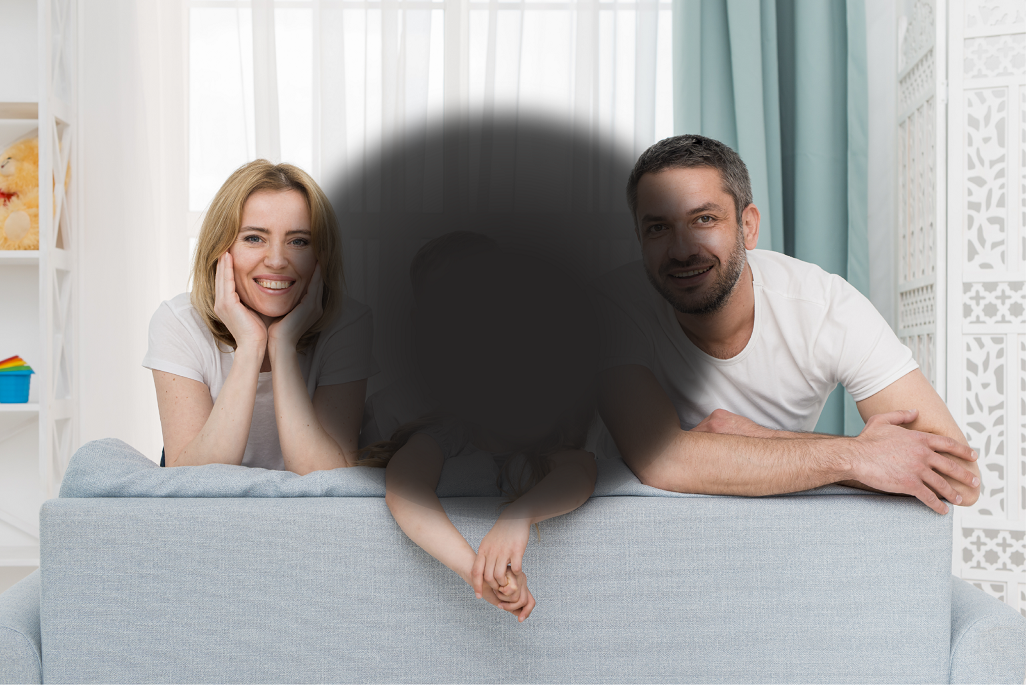 Photo of a family with a black spot in the middle to simulate central vision loss