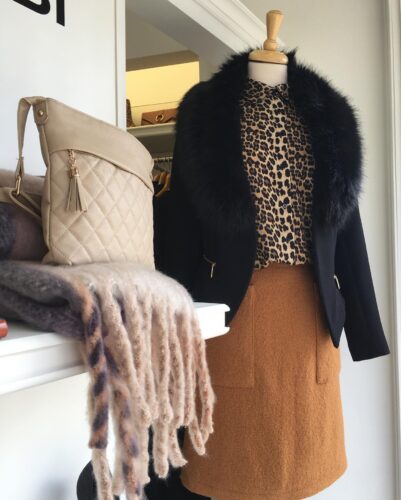 NCBI outfit: A beige letter purse, black jacket and a brown skirt