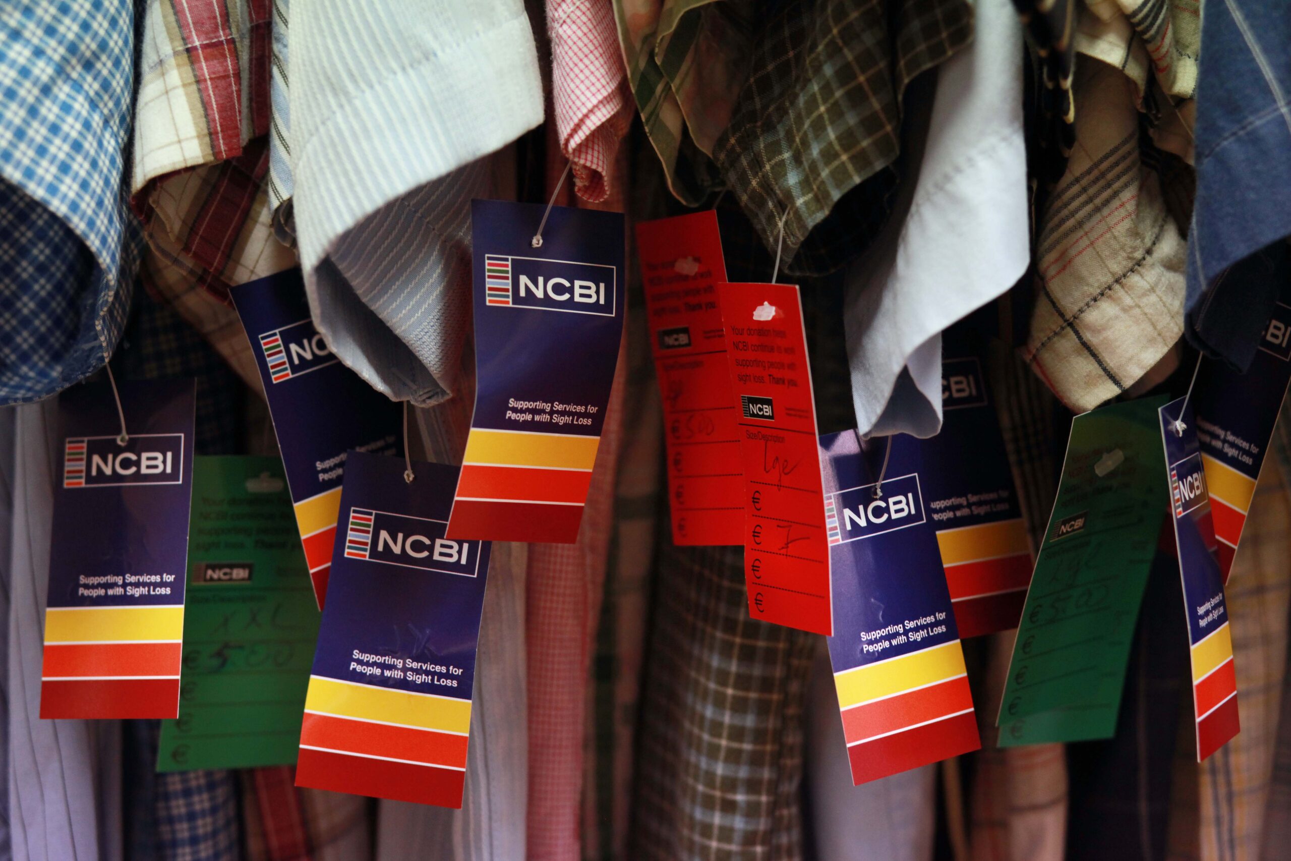 Rail full of clothes with NCBI price tags